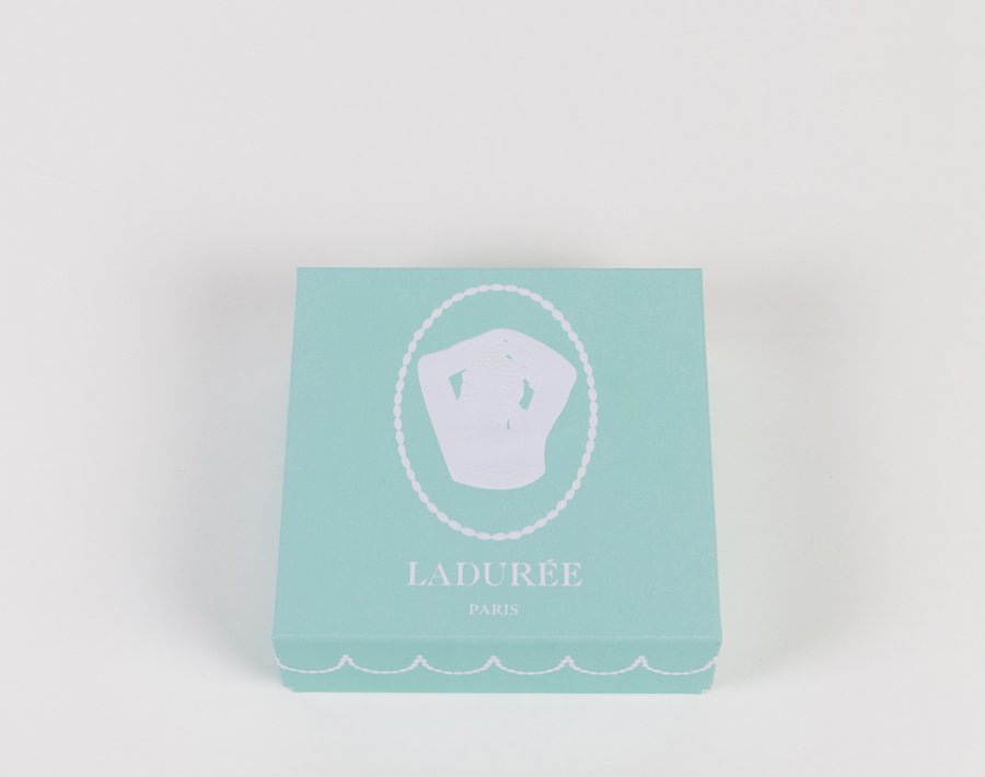 Macaron gift box Bonaparte - Ladurée Blue pastel gift box decorated with the medallion located in our parisian tea salon at St-Germain-des-Prés.